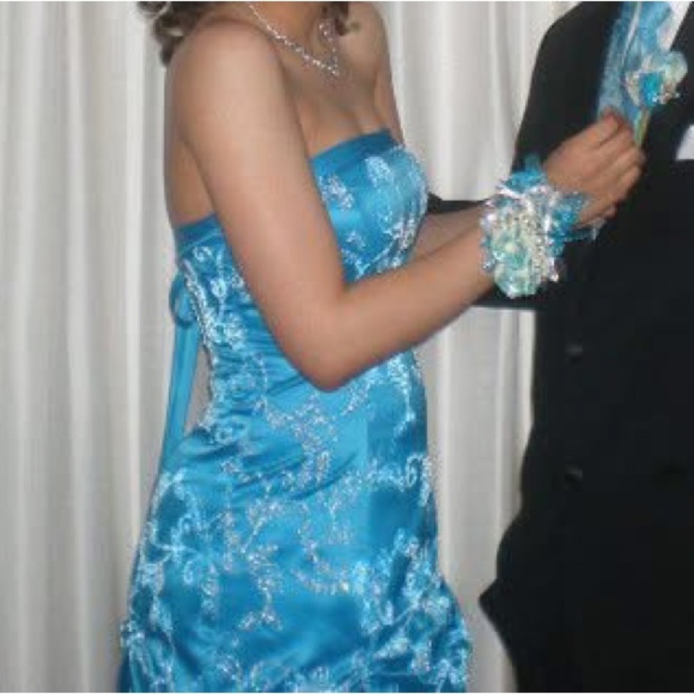 Vibrant Blue, Beaded, and Backless Formal Gown
